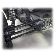 Load image into Gallery viewer, Ground clearance snapshot with billet radius rod kit beneath X3 rear end