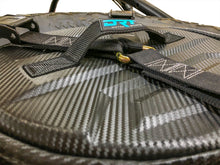 Load image into Gallery viewer, Spare tire storage bag sitting inside inverted off road wheel