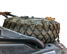 Load image into Gallery viewer, Spare tire storage bag sitting inside inverted off road wheel
