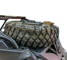Load image into Gallery viewer, Spare tire storage bag sitting inside inverted off road wheel
